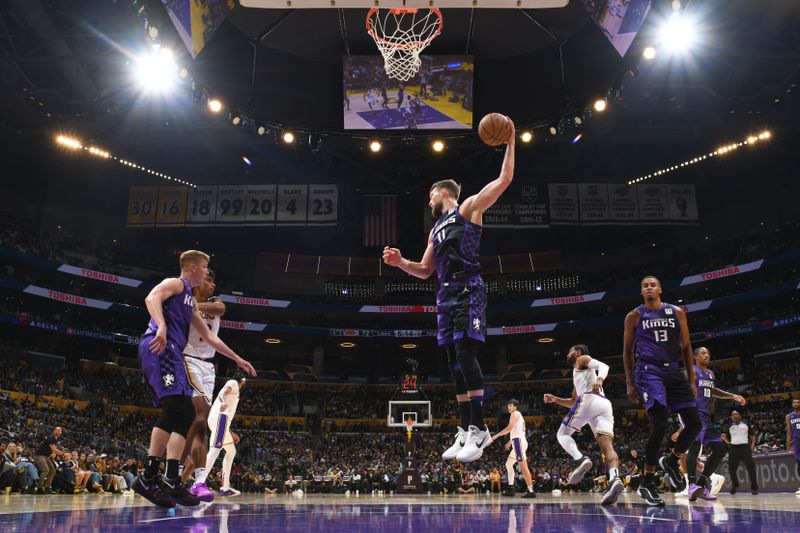 LOS ANGELES, CA - OCTOBER 26: Domantas Sabonis #11 of the Sacramento Kings goes up for the rebound during the game against the Los Angeles Lakers on October 26, 2024 at Crypto.Com Arena in Los Angeles, California. NOTE TO USER: User expressly acknowledges and agrees that, by downloading and/or using this Photograph, user is consenting to the terms and conditions of the Getty Images License Agreement. Mandatory Copyright Notice: Copyright 2024 NBAE (Photo by Adam Pantozzi/NBAE via Getty Images)