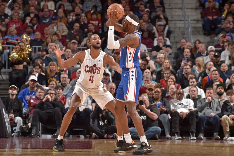 CLEVELAND, OH - MARCH 29: Evan Mobley #4 of the Cleveland Cavaliers plays defense during the game against the Philadelphia 76ers on March 29, 2024 at Rocket Mortgage FieldHouse in Cleveland, Ohio. NOTE TO USER: User expressly acknowledges and agrees that, by downloading and/or using this Photograph, user is consenting to the terms and conditions of the Getty Images License Agreement. Mandatory Copyright Notice: Copyright 2024 NBAE (Photo by David Liam Kyle/NBAE via Getty Images)