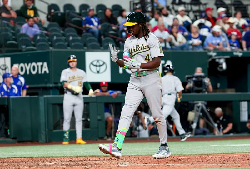 Apr 30, 2025; Arlington, Texas, USA;  Oakland Athletics right fielder Lawrence Butler (4) reacts after hitting a grand slam during the ninth inning against the Texas Rangers at Globe Life Field. Mandatory Credit: Kevin Jairaj-Imagn Images
