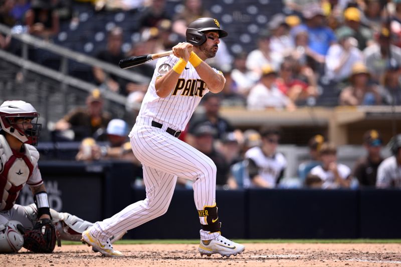 Aug 19, 2023; San Diego, California, USA; San Diego Padres first baseman hitter Matt Carpenter (14) hits an RBI single against the Arizona Diamondbacks during the fourth inning at Petco Park. Mandatory Credit: Orlando Ramirez-USA TODAY Sports