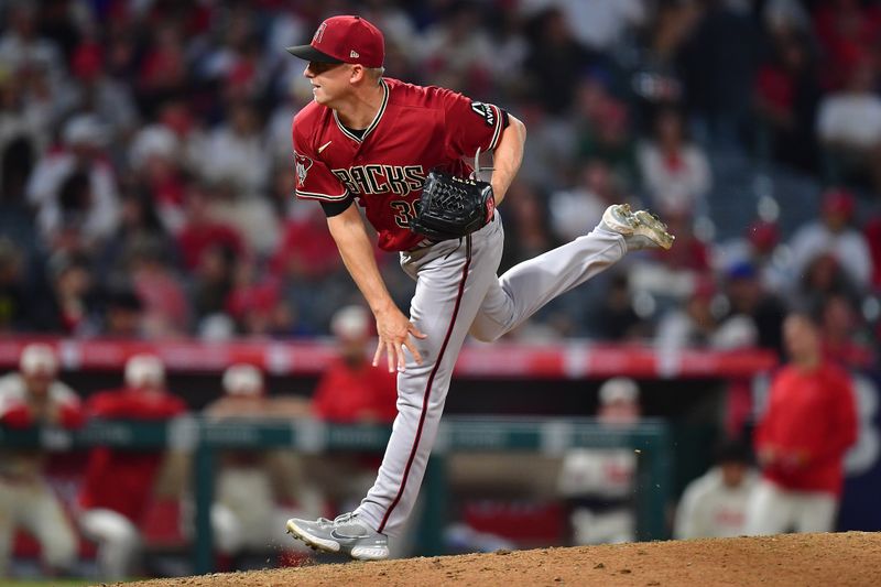 Jul 1, 2023; Anaheim, California, USA; Arizona Diamondbacks relief pitcher Scott McGough (30) throws against the Los Angeles Angels during the ninth inning at Angel Stadium. Mandatory Credit: Gary A. Vasquez-USA TODAY Sports