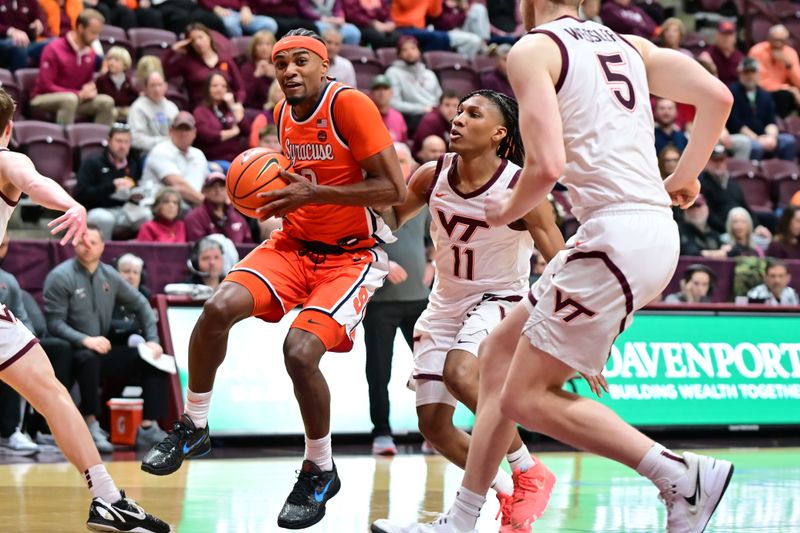 Mar 1, 2025; Blacksburg, Virginia, USA;  Syracuse Orange guard J.J. Starling (2) moves toward the basket as Virginia Tech Hokies guard Ben Hammond (11) defends during the first half at Cassell Coliseum. Mandatory Credit: Brian Bishop-Imagn Images