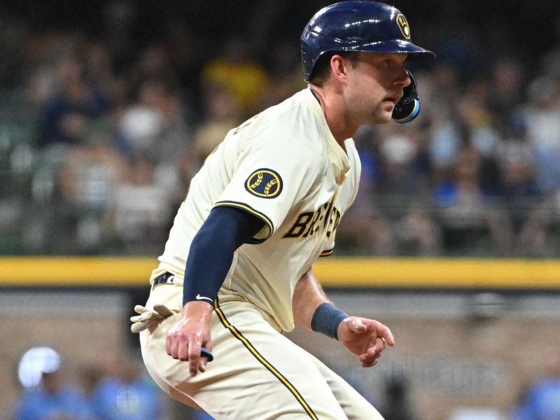 Jul 30, 2024; Milwaukee, Wisconsin, USA; Milwaukee Brewers first base Rhys Hoskins (12) on second base against the Atlanta Braves in the fifth inning at American Family Field. Mandatory Credit: Michael McLoone-USA TODAY Sports