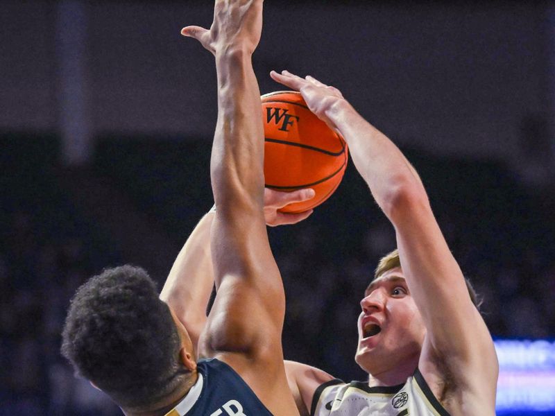 Jan 21, 2023; Winston-Salem, North Carolina, USA; Wake Forest Demon Deacons forward Andrew Carr (11) shoots over Virginia Cavaliers forward Jayden Gardner (1) during the first half at Lawrence Joel Veterans Memorial Coliseum. Mandatory Credit: William Howard-USA TODAY Sports