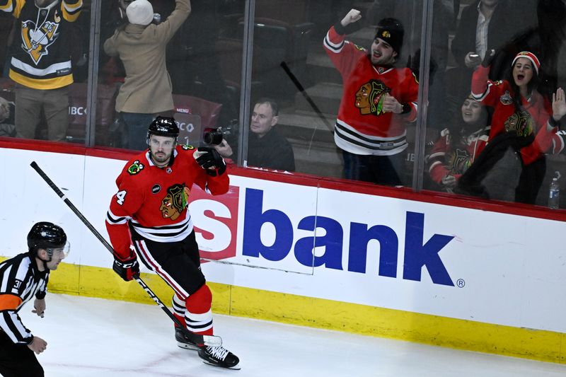 Jan 16, 2024; Chicago, Illinois, USA; Chicago Blackhawks left wing Boris Katchouk (14) pumps his fist after scoring the game winning overtime goal against the San Jose Sharks during the third period at United Center. Mandatory Credit: Matt Marton-USA TODAY Sports