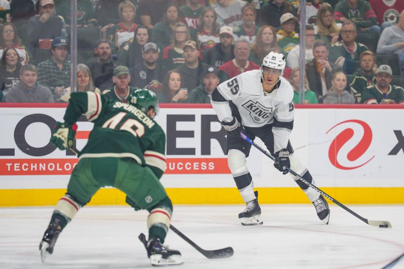 Oct 13, 2025; Saint Paul, Minnesota, USA; Los Angeles Kings right wing Quinton Byfield (55) shoots as Minnesota Wild defenseman Jared Spurgeon (46) defends in the first period at Grand Casino Arena. Mandatory Credit: Matt Blewett-Imagn Images