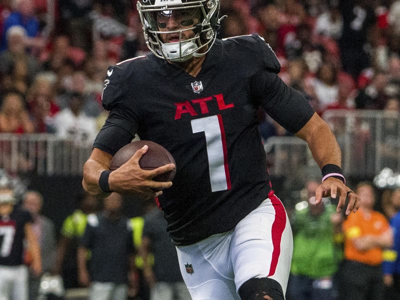 Atlanta Falcons quarterback Marcus Mariota (1) runs the ball during the second half of an NFL football game against the New Orleans Saints, Sunday, Sep. 11, 2022, in Atlanta. The New Orleans Saints won 27-26. (AP Photo/Danny Karnik)