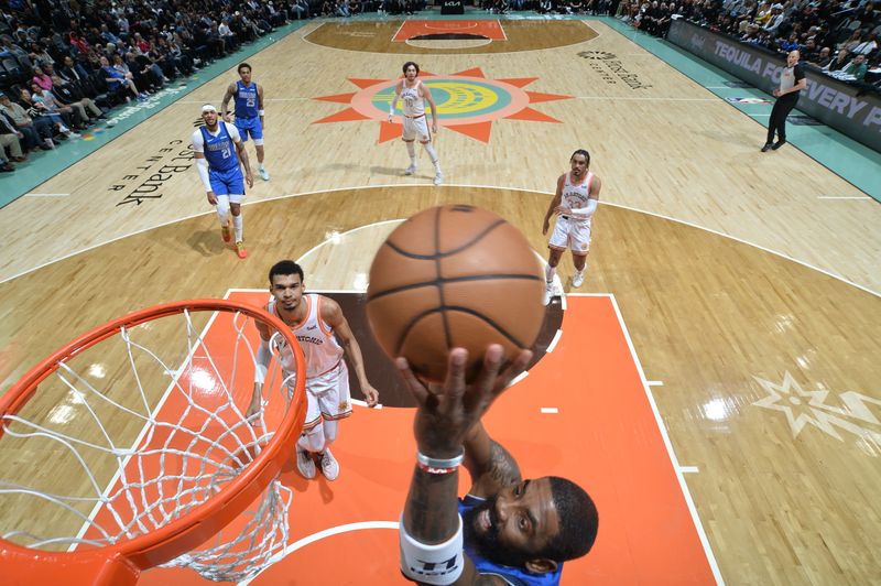 SAN ANTONIO, TX - MARCH 19: Kyrie Irving #11 of the Dallas Mavericks dunks the ball during the game against the San Antonio Spurs on March 19, 2024 at the Frost Bank Center in San Antonio, Texas. NOTE TO USER: User expressly acknowledges and agrees that, by downloading and or using this photograph, user is consenting to the terms and conditions of the Getty Images License Agreement. Mandatory Copyright Notice: Copyright 2024 NBAE (Photos by Michael Gonzales/NBAE via Getty Images)