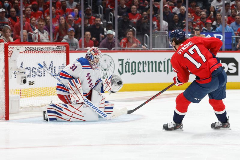 Apr 28, 2024; Washington, District of Columbia, USA; New York Rangers goaltender Igor Shesterkin (31) makes a save on Washington Capitals center Dylan Strome (17) in the first period in game four of the first round of the 2024 Stanley Cup Playoffs at Capital One Arena. Mandatory Credit: Geoff Burke-USA TODAY Sports