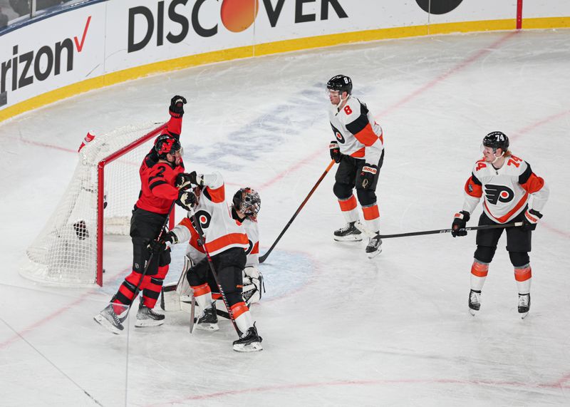 Feb 17, 2024; East Rutherford, New Jersey, USA; New Jersey Devils defenseman Brendan Smith (2) celebrates after scoring a goal past Philadelphia Flyers goaltender Samuel Ersson (33) in a Stadium Series ice hockey game at MetLife Stadium. Mandatory Credit: Vincent Carchietta-USA TODAY Sports