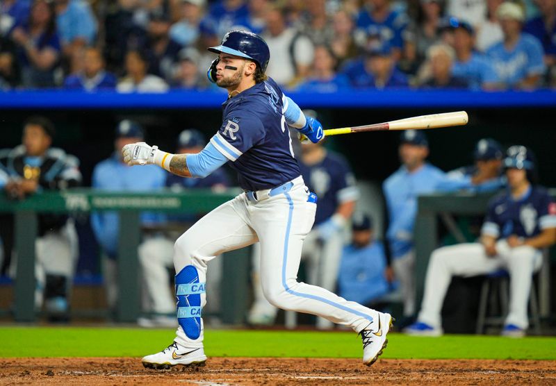 Sep 19, 2025; Kansas City, Missouri, USA; Kansas City Royals designated Carter Jensen (22) hits an RBI double during the third inning against the Toronto Blue Jays at Kauffman Stadium. Mandatory Credit: Jay Biggerstaff-Imagn Images