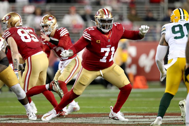 San Francisco 49ers offensive tackle Trent Williams (71) blocks during an NFL divisional round playoff football game against the Green Bay Packers Saturday, Jan. 20, 2024, in Santa Clara. (AP Photo/Scot Tucker)