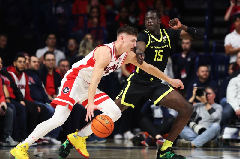 Feb 2, 2023; Tucson, Arizona, USA;  Arizona Wildcats guard Pelle Larsson (3) drives to the net against Oregon Ducks forward Lok Wur (15) in the first hall at McKale Center. Mandatory Credit: Zachary BonDurant-USA TODAY Sports
