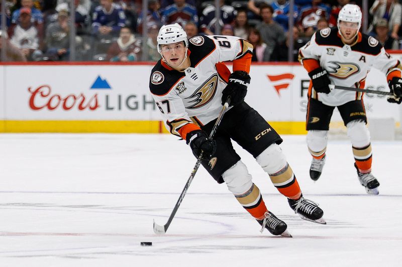 Dec 5, 2023; Denver, Colorado, USA; Anaheim Ducks defenseman Tristan Luneau (67) controls the puck in the third period against the Colorado Avalanche at Ball Arena. Mandatory Credit: Isaiah J. Downing-USA TODAY Sports