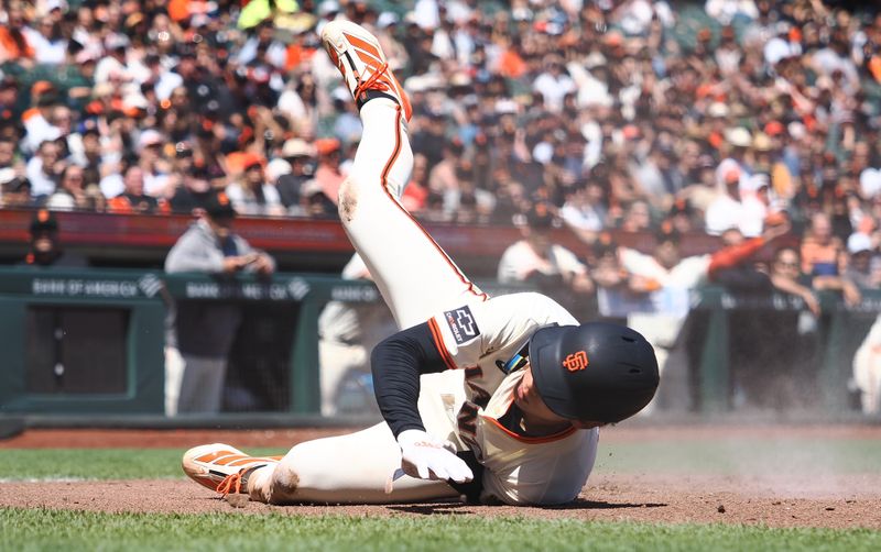 Apr 9, 2025; San Francisco, California, USA; San Francisco Giants center fielder Jung Hoo Lee (51) is tagged out at home against the Cincinnati Reds during the fourth inning at Oracle Park. Mandatory Credit: Kelley L Cox-Imagn Images