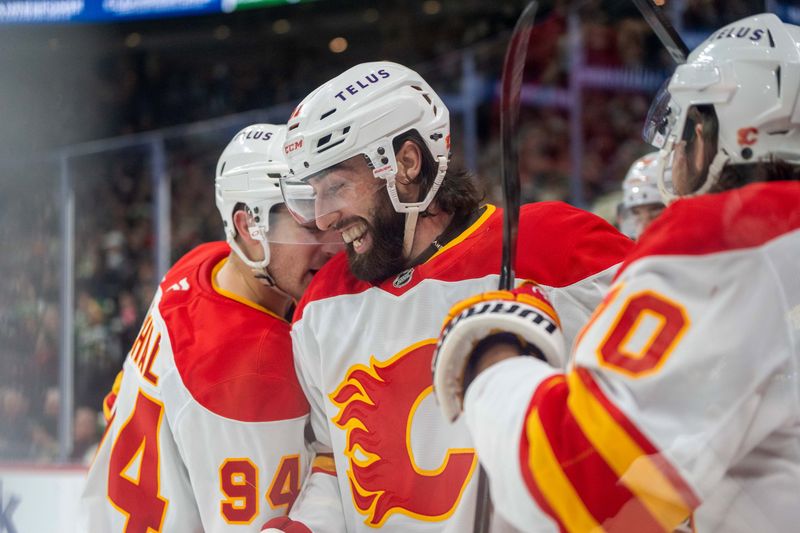Jan 25, 2025; Saint Paul, Minnesota, USA; Calgary Flames center Clark Bishop (61) smiles after scoring against the Minnesota Wild in the third period at Xcel Energy Center. Mandatory Credit: Matt Blewett-Imagn Images