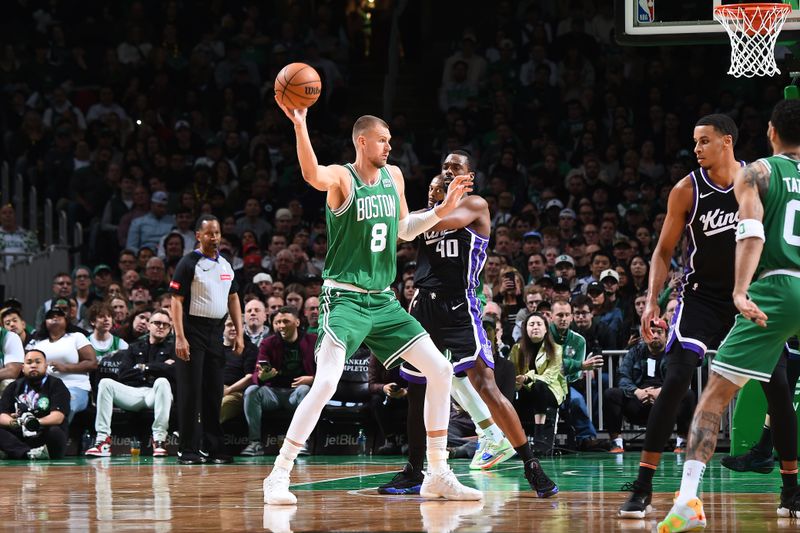 BOSTON, MA - APRIL 5:  Kristaps Porzingis #8 of the Boston Celtics handles the ball during the game against the Sacramento Kings on April 5, 2024 at the TD Garden in Boston, Massachusetts. NOTE TO USER: User expressly acknowledges and agrees that, by downloading and or using this photograph, User is consenting to the terms and conditions of the Getty Images License Agreement. Mandatory Copyright Notice: Copyright 2024 NBAE  (Photo by Brian Babineau/NBAE via Getty Images)