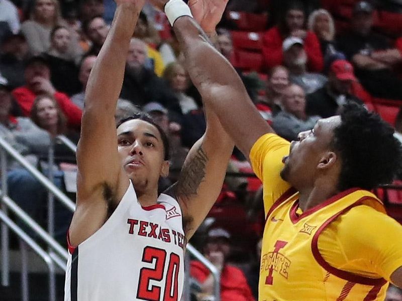 Jan 30, 2023; Lubbock, Texas, USA; Texas Tech Red Raiders guard Jaylen Tyson (20) takes a shot over  Iowa State Cyclones center Osun Osunniyi (21) in the first half at United Supermarkets Arena. Mandatory Credit: Michael C. Johnson-USA TODAY Sports