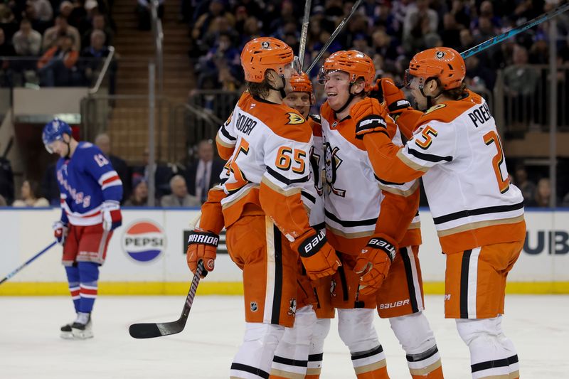 Dec 15, 2025; New York, New York, USA; Anaheim Ducks defenseman Jackson Lacombe (2) celebrates his goal against the New York Rangers with teammates during the second period at Madison Square Garden. Mandatory Credit: Brad Penner-Imagn Images