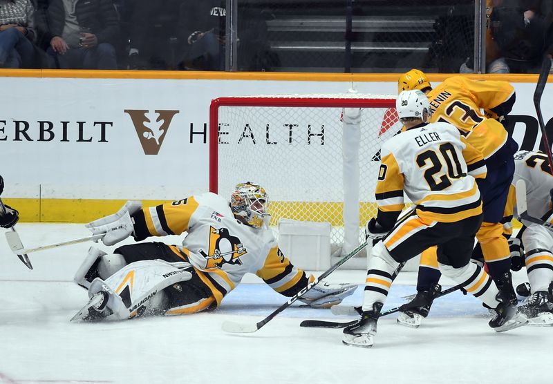 Nov 28, 2023; Nashville, Tennessee, USA; Pittsburgh Penguins goaltender Tristan Jarry (35) watches as a shot goes wide of the net during the second period against the Nashville Predators at Bridgestone Arena. Mandatory Credit: Christopher Hanewinckel-USA TODAY Sports