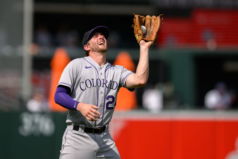 Aug 27, 2023; Baltimore, Maryland, USA; Colorado Rockies third baseman Ryan McMahon (24) catches a fly ball during the eighth inning against the Baltimore Orioles at Oriole Park at Camden Yards. Mandatory Credit: Reggie Hildred-USA TODAY Sports