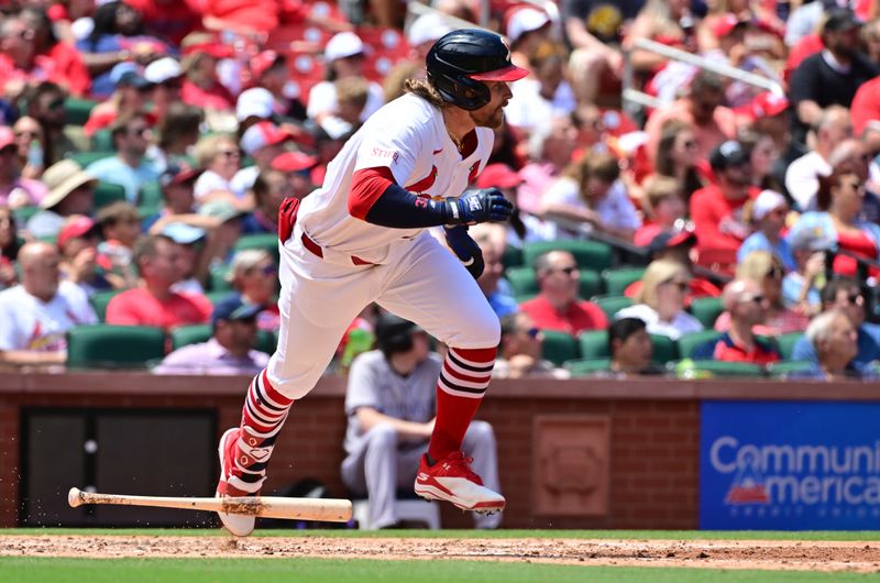 Jun 9, 2024; St. Louis, Missouri, USA; St. Louis Cardinals outfielder Brendan Donovan (33) hits a single against the Colorado Rockies in the fourth innning at Busch Stadium. Mandatory Credit: Tim Vizer-USA TODAY Sports