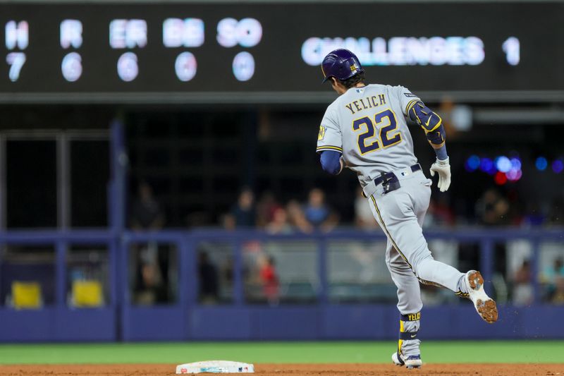 Sep 22, 2023; Miami, Florida, USA; Milwaukee Brewers left fielder Christian Yelich (22) circles the bases after hitting a home run against the Miami Marlins during the second inning at loanDepot Park. Mandatory Credit: Sam Navarro-USA TODAY Sports