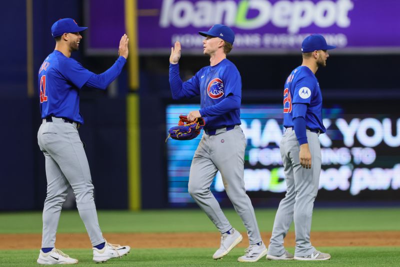 Aug 23, 2024; Miami, Florida, USA; Chicago Cubs center fielder Pete Crow-Armstrong (52) celebrates with relief pitcher Jorge Lopez (41) after the game against the Miami Marlins at loanDepot Park. Mandatory Credit: Sam Navarro-USA TODAY Sports