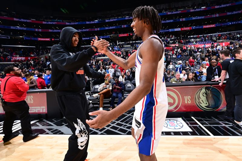 LOS ANGELES, CA - JANUARY 17: Terance Mann #14 of the LA Clippers and Tyrese Maxey #0 of the Philadelphia 76ers after the game on January 17, 2023 at Crypto.Com Arena in Los Angeles, California. NOTE TO USER: User expressly acknowledges and agrees that, by downloading and/or using this Photograph, user is consenting to the terms and conditions of the Getty Images License Agreement. Mandatory Copyright Notice: Copyright 2023 NBAE (Photo by Adam Pantozzi/NBAE via Getty Images)