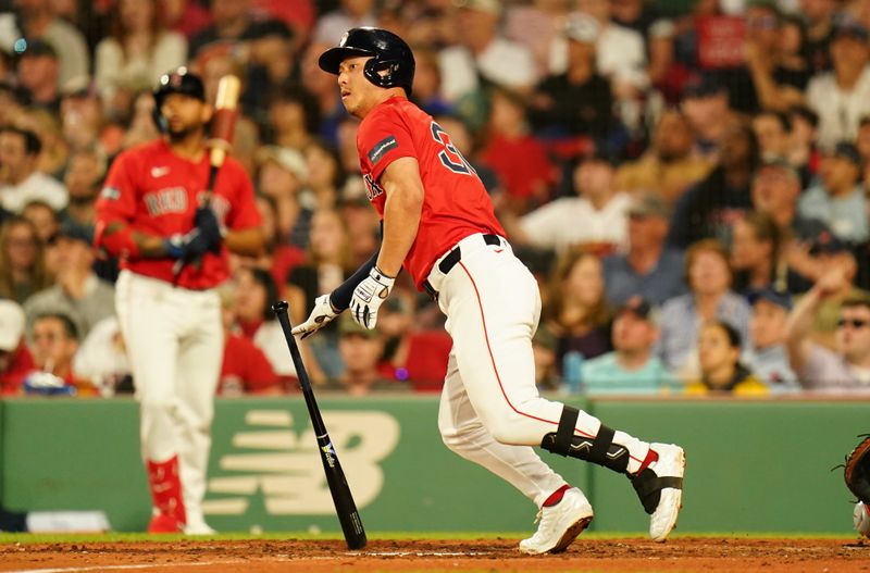 May 31, 2024; Boston, Massachusetts, USA; Boston Red Sox left fielder Rob Refsnyder (30) hits a double to drive in a run against the Detroit Tigers in the fifth inning at Fenway Park. Mandatory Credit: David Butler II-USA TODAY Sports