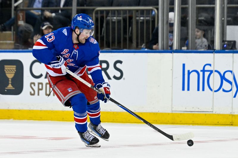 Mar 10, 2026; New York, New York, USA;  New York Rangers left wing Alexis Lafrenière (13) skates across center ice against the Calgary Flames during the third period at Madison Square Garden. Mandatory Credit: Dennis Schneidler-Imagn Images