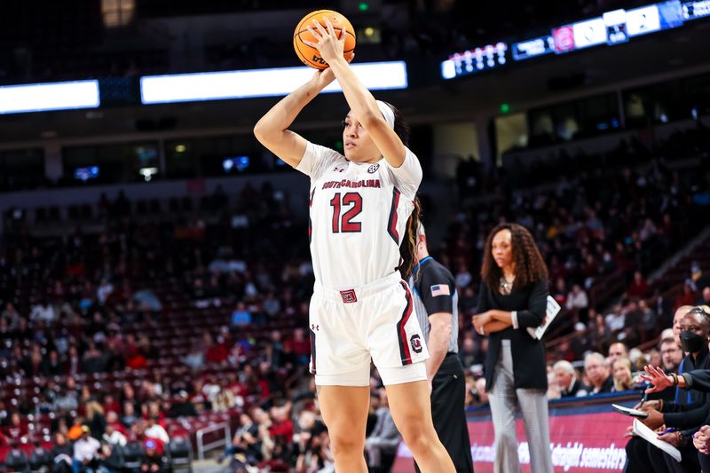 Feb 2, 2023; Columbia, South Carolina, USA; South Carolina Gamecocks guard Brea Beal (12) makes a three point basket against the Kentucky Wildcats in the first half at Colonial Life Arena. Mandatory Credit: Jeff Blake-USA TODAY Sports