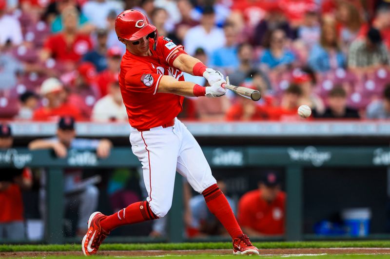 Apr 30, 2025; Cincinnati, Ohio, USA; Cincinnati Reds designated hitter Matt McLain (9) hits a single in the first inning against the St. Louis Cardinals at Great American Ball Park. Mandatory Credit: Katie Stratman-Imagn Images