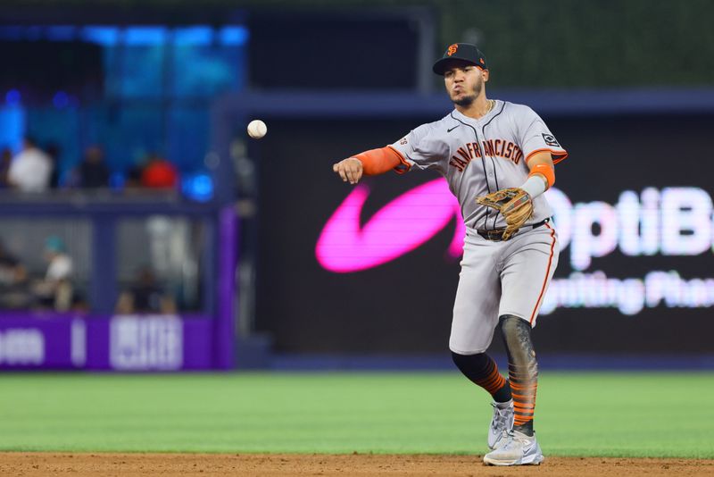 Apr 17, 2024; Miami, Florida, USA; San Francisco Giants second baseman Thairo Estrada (39) throws to first base and retires Miami Marlins first baseman Josh Bell (not pictured) during the seventh inning at loanDepot Park. Mandatory Credit: Sam Navarro-USA TODAY Sports