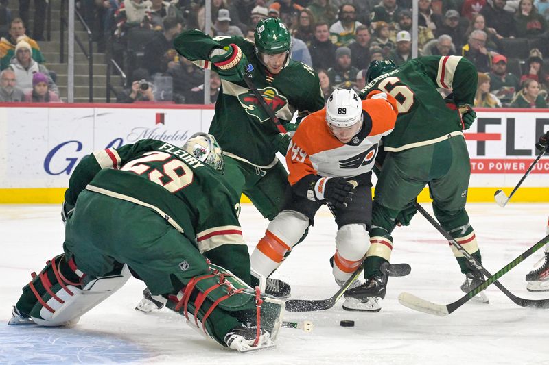 Jan 12, 2024; Saint Paul, Minnesota, USA; Philadelphia Flyers forward Cam Atkinson (89) hunts for a rebound as Minnesota Wild defenseman Jon Merrill (4) and defenseman Dakota Mermis (6) defend in front of goalie Marc-Andre Fleury (29) during the first period at Xcel Energy Center. Mandatory Credit: Nick Wosika-USA TODAY Sports