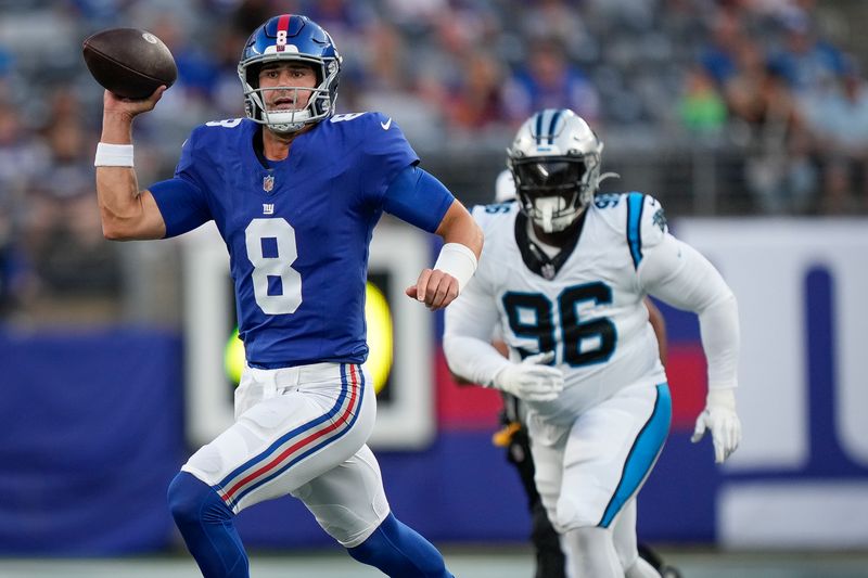 New York Giants quarterback Daniel Jones runs with the ball during the first half of an NFL preseason football game against the Carolina Panthers, Friday, Aug. 18, 2023, in East Rutherford, N.J. (AP Photo/Bryan Woolston)