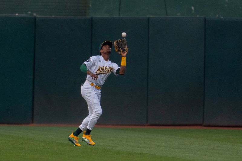 Sep 19, 2023; Oakland, California, USA; Oakland Athletics center fielder Esteury Ruiz (1) fields a fly ball against the Seattle Mariners during the first inning at Oakland-Alameda County Coliseum. Mandatory Credit: Neville E. Guard-USA TODAY Sports