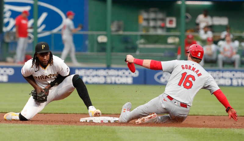 Jul 2, 2024; Pittsburgh, Pennsylvania, USA;  Pittsburgh Pirates shortstop Oneil Cruz (15) forces St. Louis Cardinals second baseman Nolan Gorman (16) out second base during the sixth inning at PNC Park. Mandatory Credit: Charles LeClaire-USA TODAY Sports