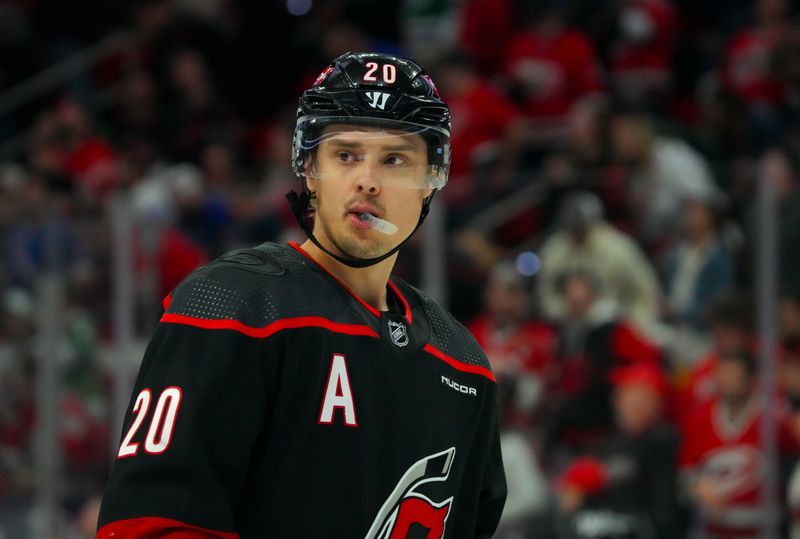 Mar 12, 2024; Raleigh, North Carolina, USA; Carolina Hurricanes center Sebastian Aho (20) looks on against the New York Rangers during the second period at PNC Arena. Mandatory Credit: James Guillory-USA TODAY Sports