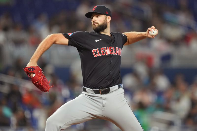 Jun 9, 2024; Miami, Florida, USA; Cleveland Guardians pitcher Sam Hentges (31) pitches in the seventh inning against the Miami Marlins at loanDepot Park. Mandatory Credit: Jim Rassol-USA TODAY Sports