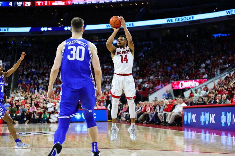 Jan 4, 2023; Raleigh, North Carolina, USA;  North Carolina State Wolfpack guard Casey Morsell (14) shoots a three pointer during the first half against Duke Blue Devils at at PNC Arena. Mandatory Credit: Jaylynn Nash-USA TODAY Sports