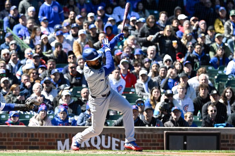 Apr 5, 2024; Chicago, Illinois, USA;  Los Angeles Dodgers right fielder Teoscar Hernandez hits a single against the Chicago Cubs during the first inning at Wrigley Field. Mandatory Credit: Matt Marton-USA TODAY Sports