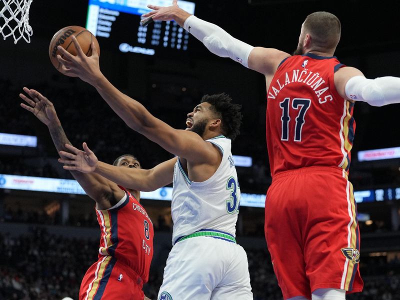 MINNEAPOLIS, MN -  JANUARY 3:  Karl-Anthony Towns #32 of the Minnesota Timberwolves drives to the basket during the game against the New Orleans Pelicans on January 3, 2024 at Target Center in Minneapolis, Minnesota. NOTE TO USER: User expressly acknowledges and agrees that, by downloading and or using this Photograph, user is consenting to the terms and conditions of the Getty Images License Agreement. Mandatory Copyright Notice: Copyright 2024 NBAE (Photo by Jordan Johnson/NBAE via Getty Images)