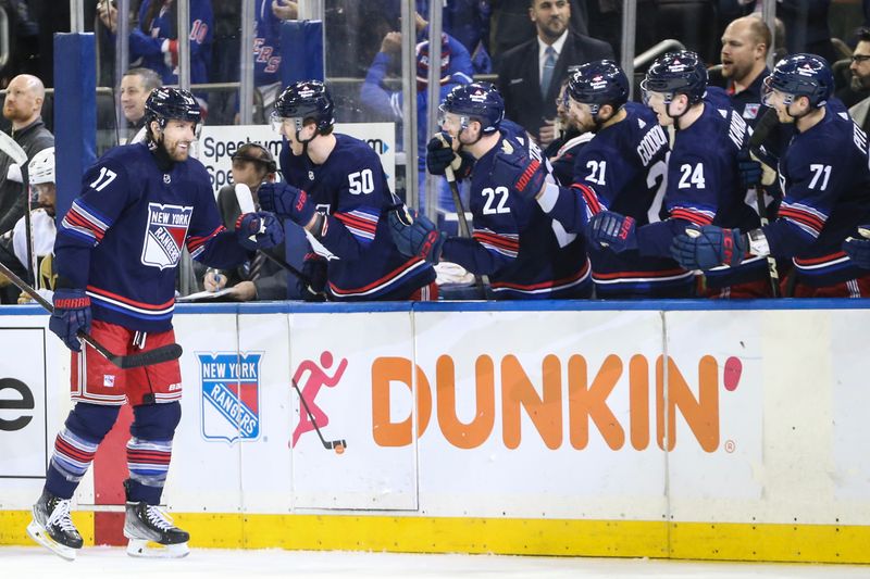 Jan 26, 2024; New York, New York, USA; New York Rangers right wing Blake Wheeler (17) celebrates with his teammates after scoring a goal in the first period against the Vegas Golden Knights at Madison Square Garden. Mandatory Credit: Wendell Cruz-USA TODAY Sports