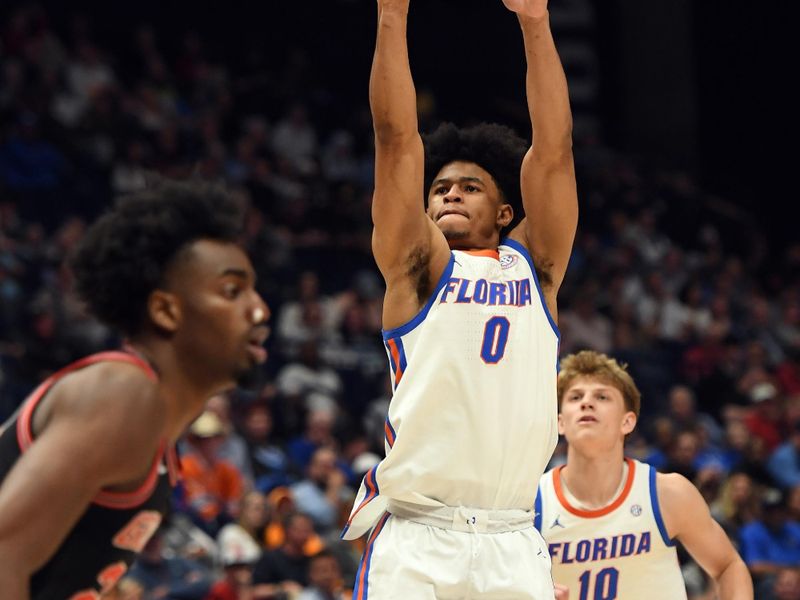 Mar 14, 2024; Nashville, TN, USA; Florida Gators guard Zyon Pullin (0) shoots the ball during the first half against the Georgia Bulldogs at Bridgestone Arena. Mandatory Credit: Christopher Hanewinckel-USA TODAY Sports