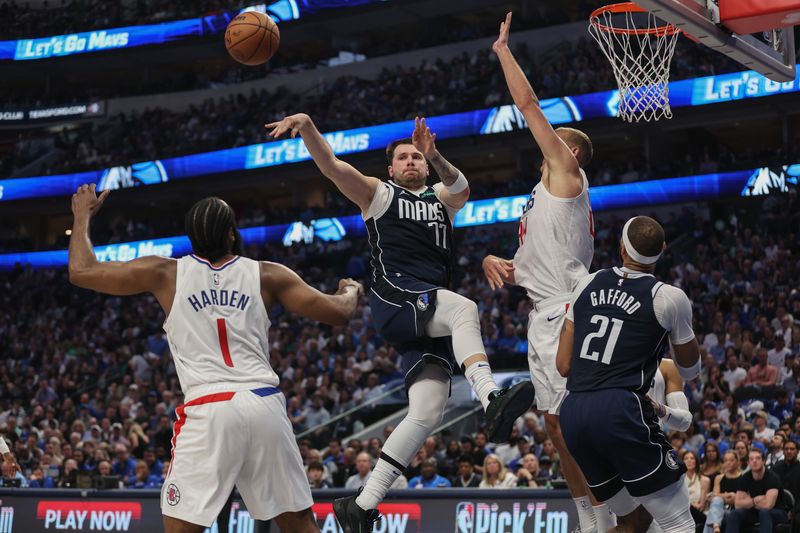 DALLAS, TEXAS - APRIL 28: Luka Doncic #77 of the Dallas Mavericks passes the ball while defended by Mason Plumlee #44 and James Harden #1 of the Los Angeles Clippers in the first half of game four of the Western Conference First Round Playoffs at American Airlines Center on April 28, 2024 in Dallas, Texas.  NOTE TO USER: User expressly acknowledges and agrees that, by downloading and or using this photograph, User is consenting to the terms and conditions of the Getty Images License Agreement. (Photo by Tim Warner/Getty Images)