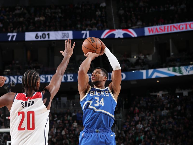 MILWAUKEE, WI - NOVEMBER 30: Giannis Antetokounmpo #34 of the Milwaukee Bucks shoots a three point basket during the game against the Washington Wizards on November 30, 2024 at Fiserv Forum Center in Milwaukee, Wisconsin. NOTE TO USER: User expressly acknowledges and agrees that, by downloading and or using this Photograph, user is consenting to the terms and conditions of the Getty Images License Agreement. Mandatory Copyright Notice: Copyright 2024 NBAE (Photo by Gary Dineen/NBAE via Getty Images).