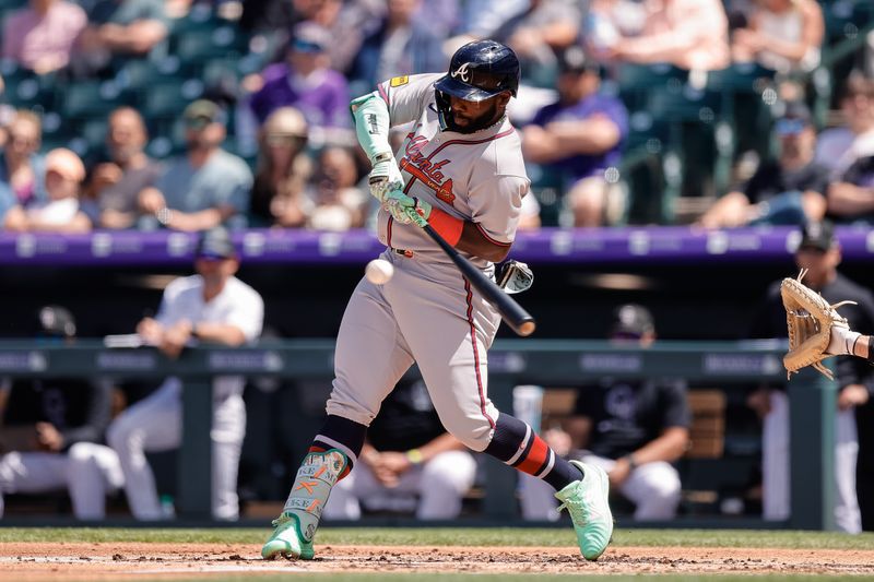 Apr 30, 2025; Denver, Colorado, USA; Atlanta Braves center fielder Michael Harris II (23) hits a ground out RBI in the third inning against the Colorado Rockies at Coors Field. Mandatory Credit: Isaiah J. Downing-Imagn Images