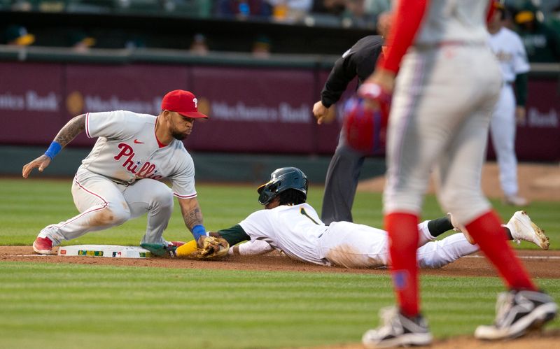 Jun 16, 2023; Oakland, California, USA; Oakland Athletics center fielder Esteury Ruiz (1) steals third base ahead of the tag by Philadelphia Phillies third baseman Edmundo Sosa (33) during the sixth inning at Oakland-Alameda County Coliseum. Mandatory Credit: D. Ross Cameron-USA TODAY Sports