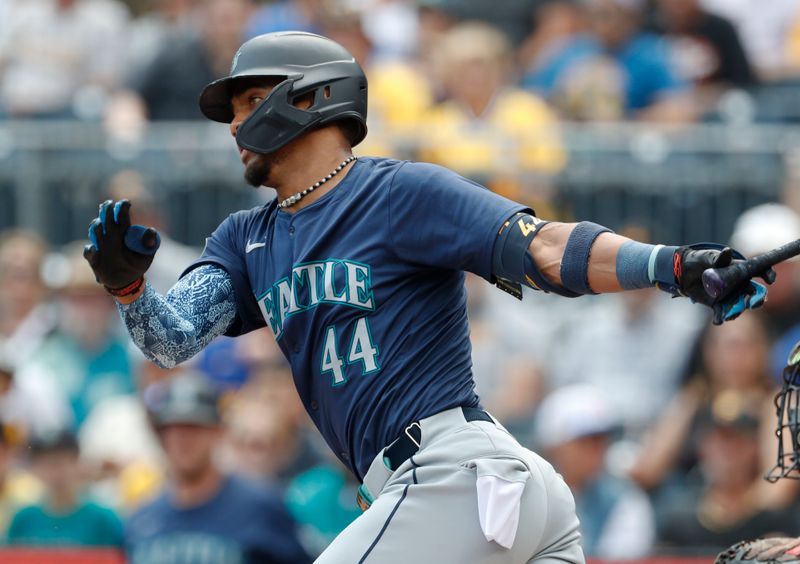 Aug 18, 2024; Pittsburgh, Pennsylvania, USA;  Seattle Mariners designated hitter Julio Rodríguez (44) hits a single against the Pittsburgh Pirates during the first inning at PNC Park. Mandatory Credit: Charles LeClaire-USA TODAY Sports